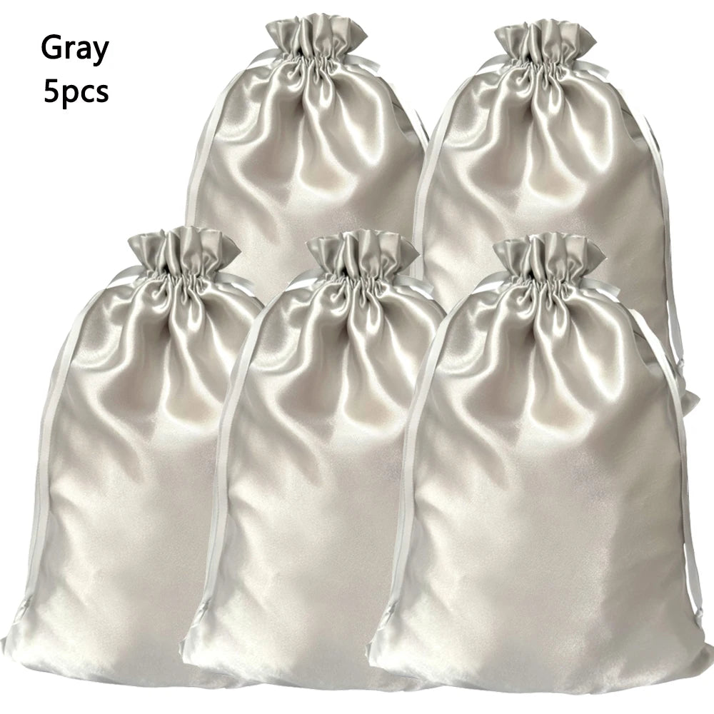 Five gray satin drawstring storage bags for hair tools