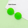 Two bright green silicone eyeglass grips on a white background.