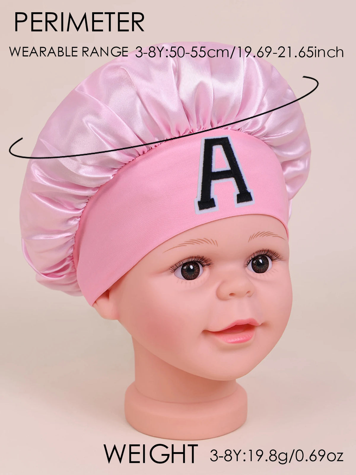 Pink A-Z letter sleep cap for kids shown on a baby model, with weight specifications.