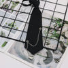 A black classic chain necktie is displayed against a grid background of nature photos.