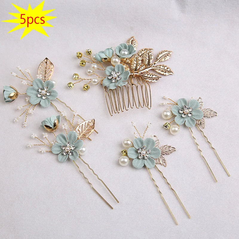 Set of five floral pearl bridal hair accessories featuring light blue flowers and gold accents