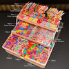 A wooden box filled with various colorful hair accessories and butterfly clips in assorted colors