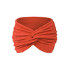 A folded orange fabric headband used for yoga or sports.