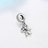 A silver family tree charm jewelry piece featuring a charm of a figure and a circular pendant.
