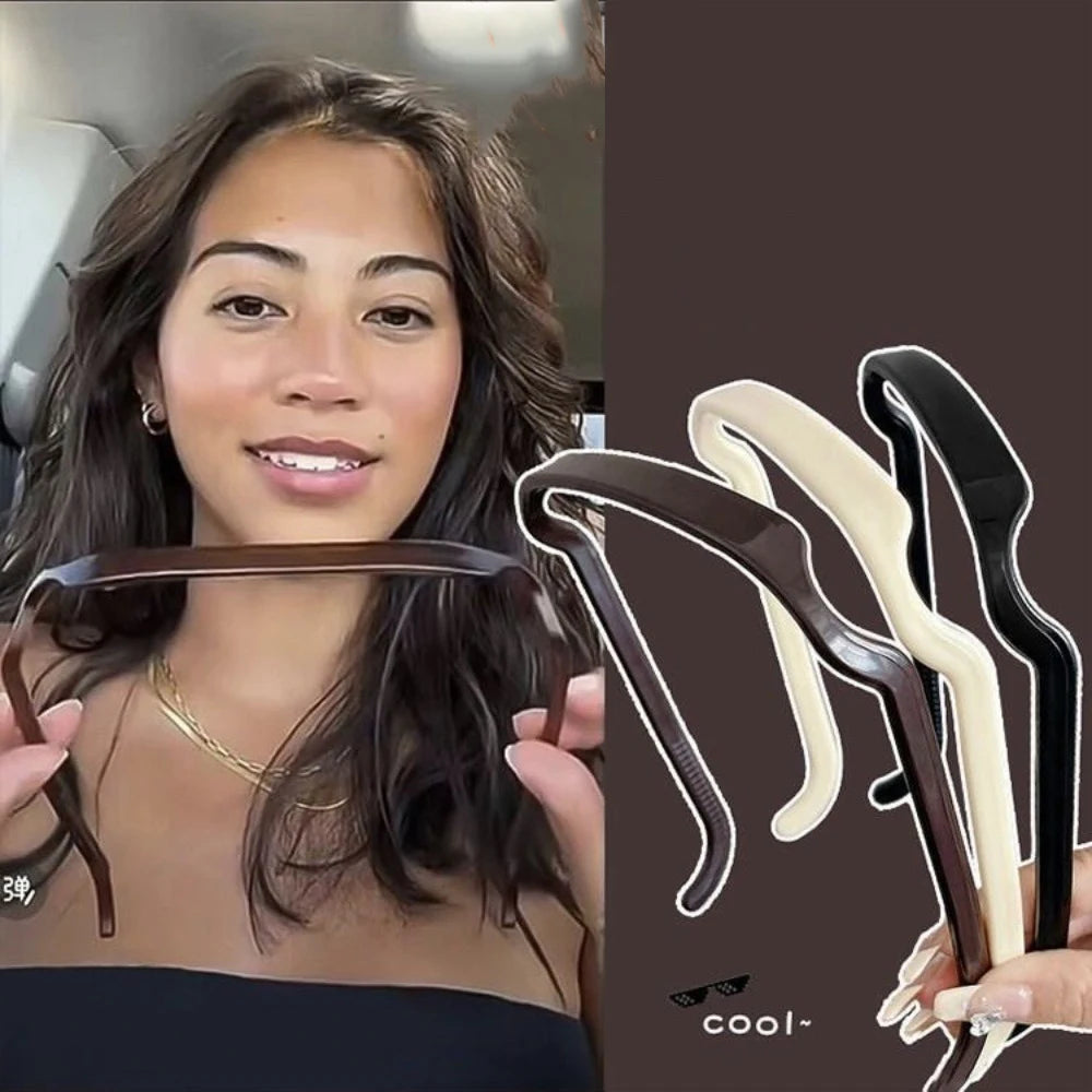 A woman models three sleek hair sticks in brown, cream, and black for elegant styling.