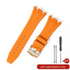Orange silicone watch band with a quick release buckle and a separate pin for replacement
