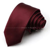 A deep burgundy satin neck tie folded and displayed on a white background.