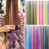 Close-up of various rainbow glitter hair extensions and braids displayed on a model's hair.