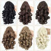 A collection of 14-inch claw clip ponytail extensions in various shades of brown and blonde curls.
