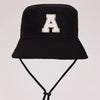 Black sun hat with a white letter A print and an adjustable cord