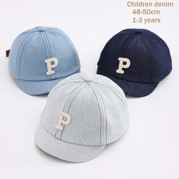 Three denim baseball caps in light blue, dark blue, and gray for children aged 1 to 3 years