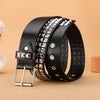 Black leather belt featuring silver rivets and studs, shown on a beige background.