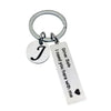 Silver keychain with a J charm and a tag that reads Drive Safe I need you here with me