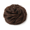 A close-up of a dark brown messy bun hairstyle for curly updos.