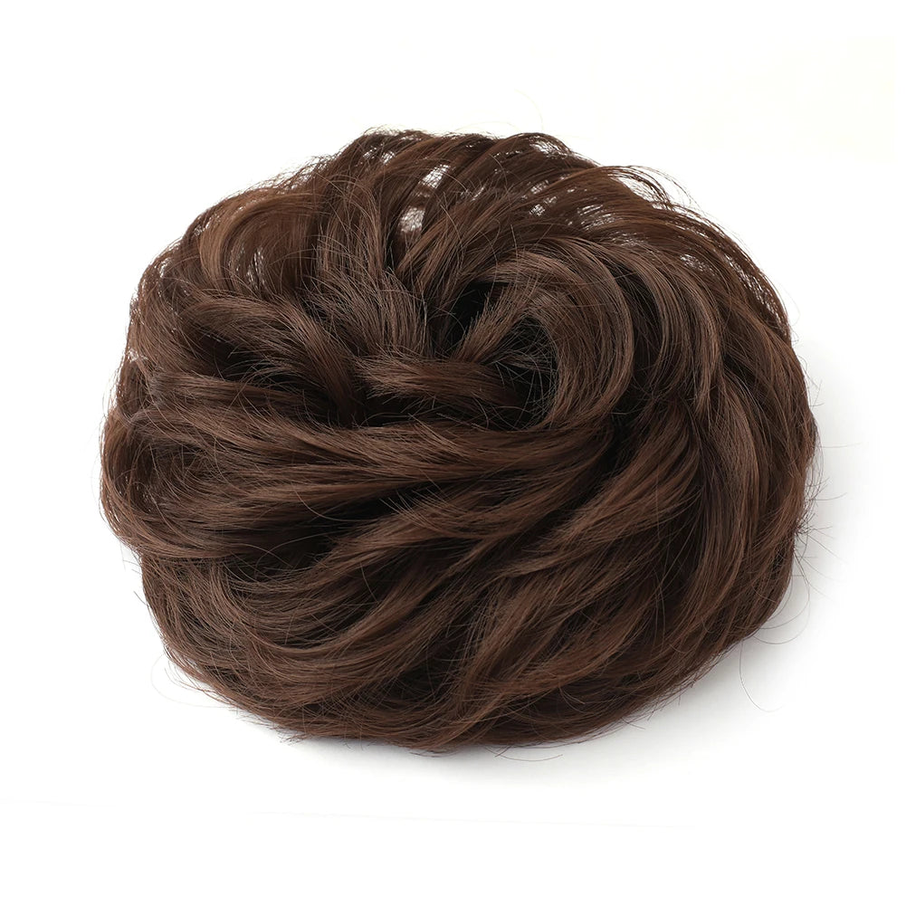 A close-up of a dark brown messy bun hairstyle for curly updos.
