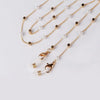 Gold chain lanyard with pearl beads and a clear charm for sunglasses