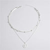 Silver stainless steel necklace with a delicate chain and a round zircon cross pendant