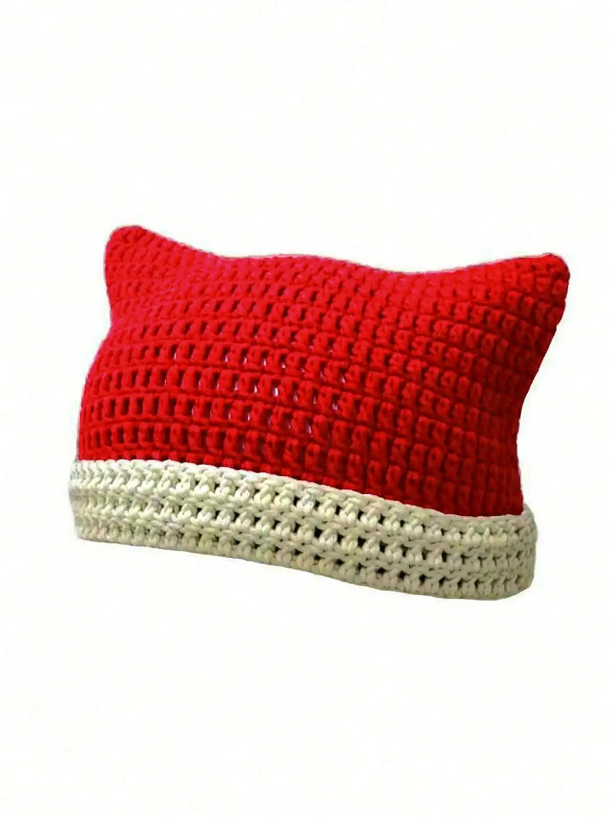 A bright red crocheted cat ears beanie hat with a cream-colored brim.