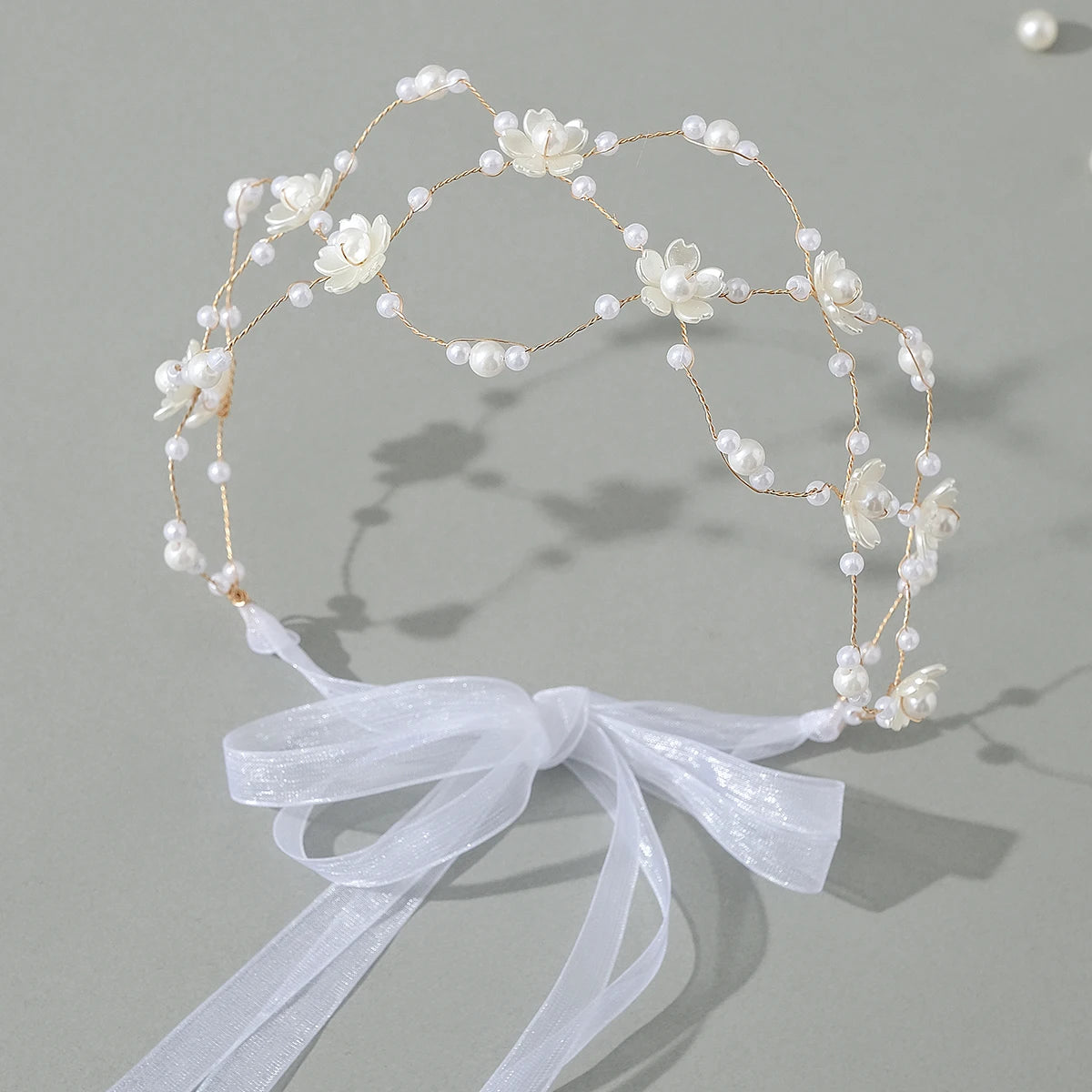 Elegant pearl hair net headband for women featuring delicate white flowers and pearls