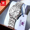 A silver stainless steel watch with a metal bracelet and a white tag is displayed in a box.
