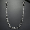 Silver double-layer waist chain accessory with a lobster clasp and a decorative link pattern.