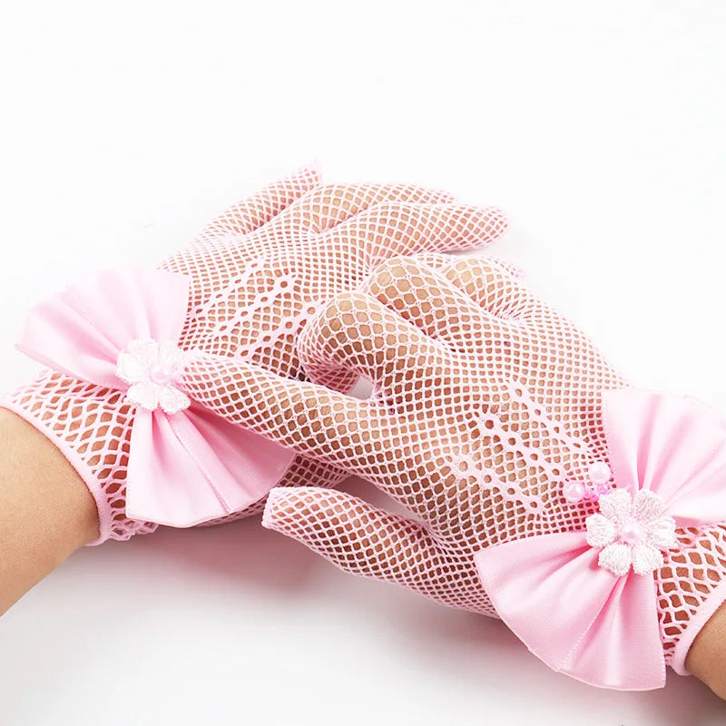 Pink bridal mesh finger gloves with floral accents shown on a hand.