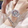 A close-up of a luxury women's watch featuring a diamond-encrusted bezel and a rotating 360 degree mechanism on a wrist.