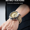 A close-up of a warm brown retro texture men's quartz watch with a light dial and tan leather strap on a wrist.
