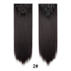 A pair of long, straight black hair extensions with clip-in attachments.