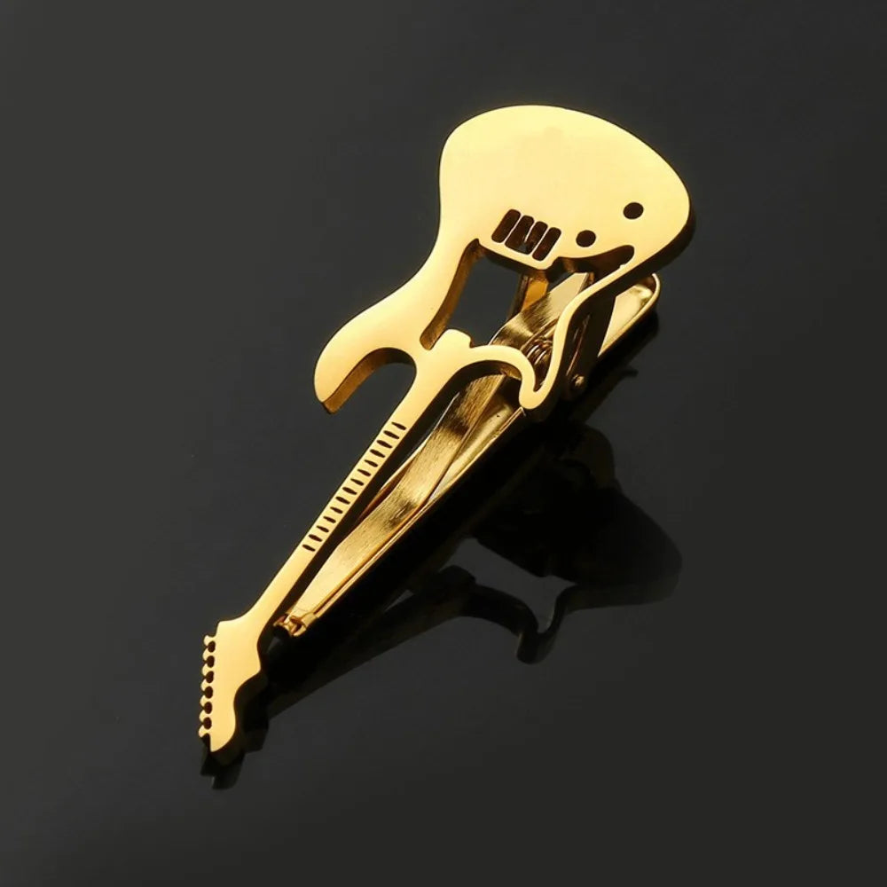 Goldfarbener Titan-Kugelknoten in Gitarrenform mit Plektrum und Griffbrettmuster.