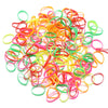 A pile of colorful elastic hair ties in various shades of pink, orange, green, and yellow.
