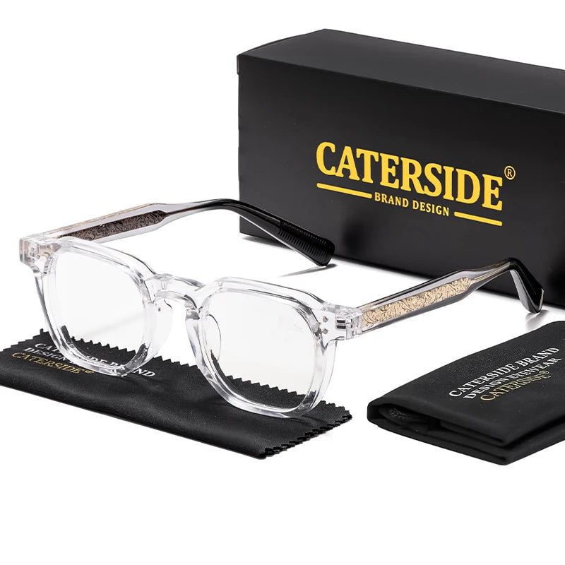 A pair of clear retro square anti-blue light eyeglasses resting on a black cloth next to a black box labeled CATERSIDE BRAND 