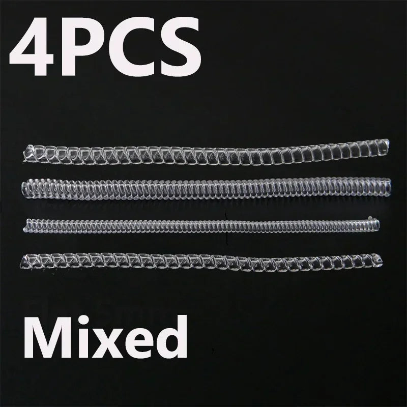 Four pieces of mixed invisible ring size adjusters displayed on a black background.