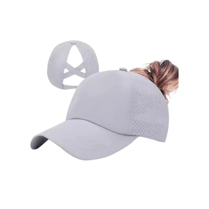 A light gray breathable mesh criss-cross baseball cap shown from the side with a person's hair visible.