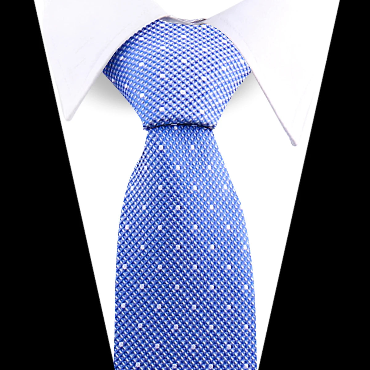 Blue patterned silk necktie worn under a white dress shirt.