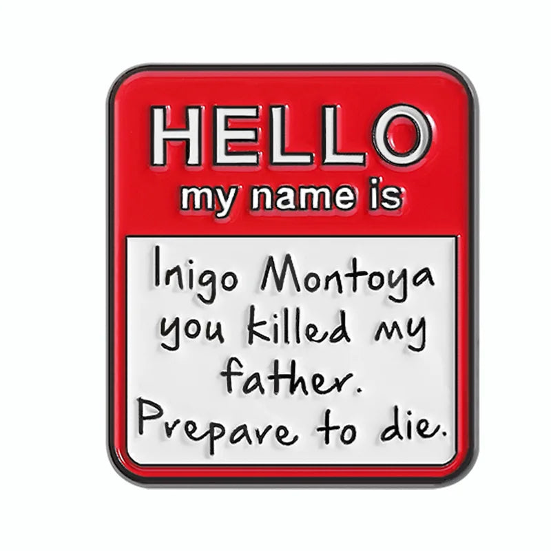 A red enamel lapel pin with the text HELLO my name is Inigo Montoya you killed my father Prepare to die.