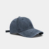 A dark gray washed cotton snapback cap shown from the side.