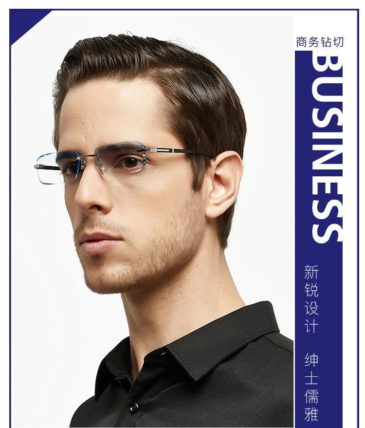 A man wearing frameless diamond cut reading glasses against a white background.