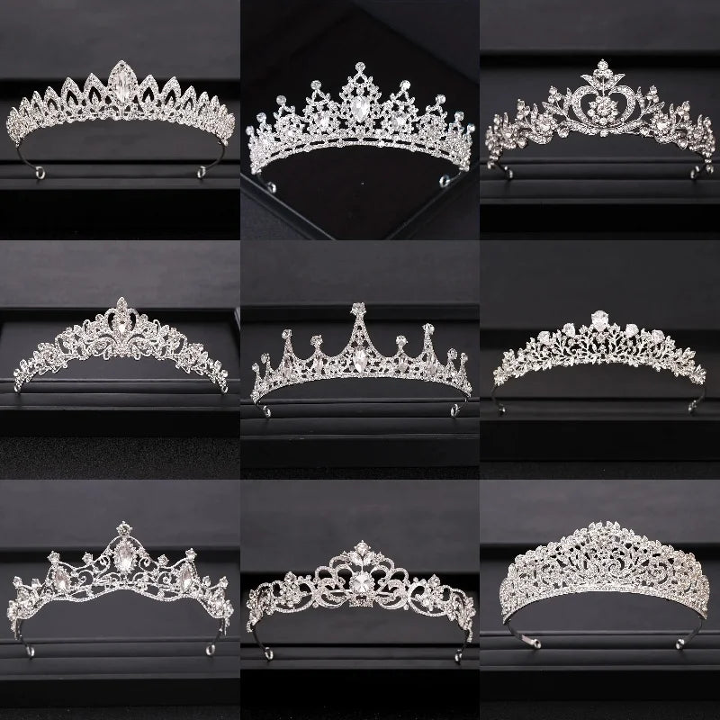 A collection of ornate silver and crystal bridal crowns displayed on a black velvet background.