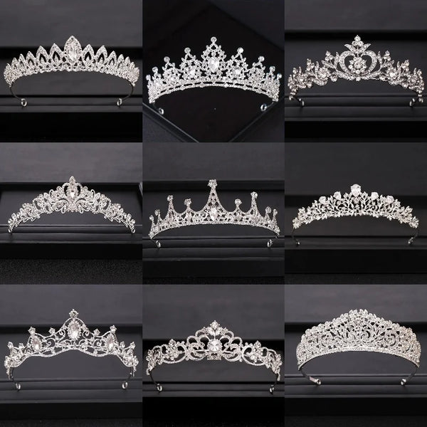 A collection of ornate silver and crystal bridal crowns displayed on a black velvet background.