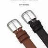 A close-up of a brown leather belt with a silver buckle and a black strap.