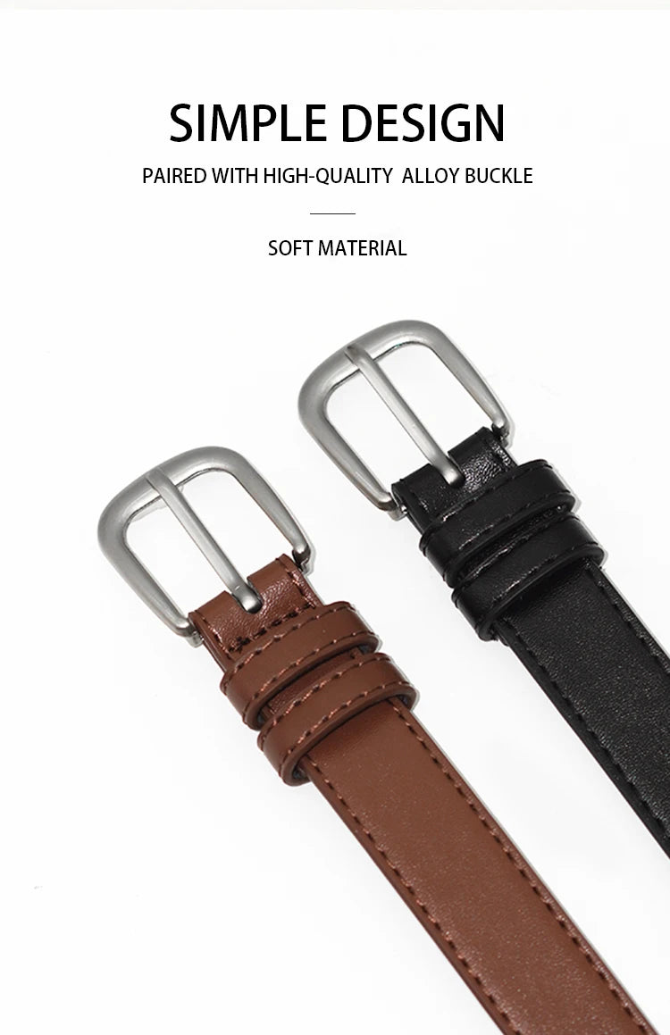 A close-up of a brown leather belt with a silver buckle and a black strap.