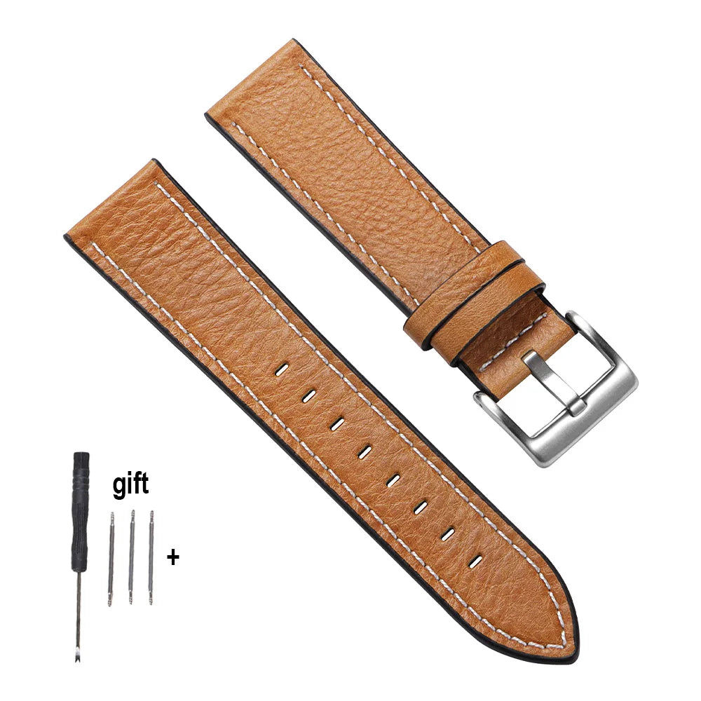 A brown handmade calfskin leather watch strap with a silver buckle and included tools.