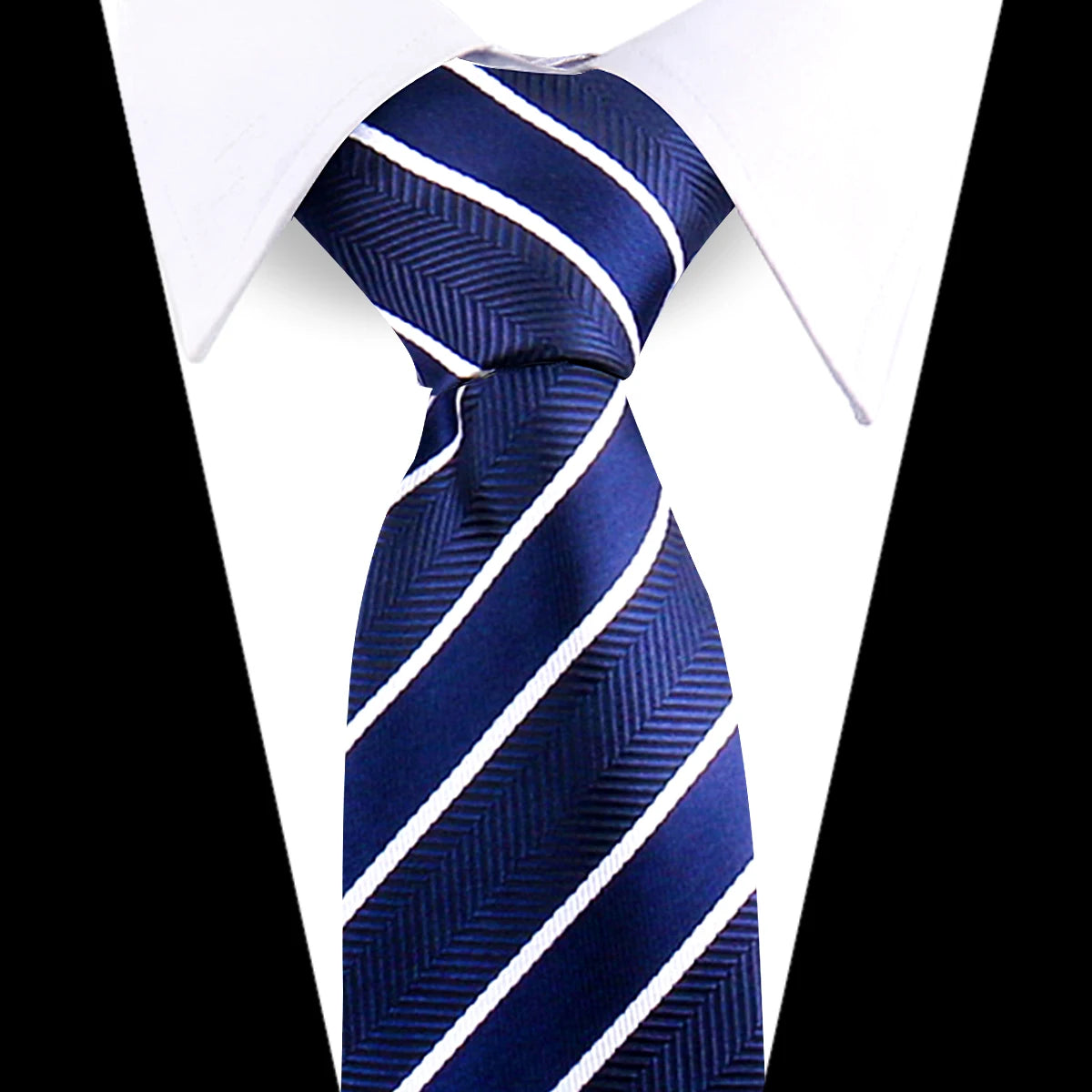 A dark blue silk necktie with diagonal white stripes worn under a white dress shirt.