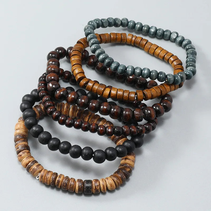 A stack of fashion elastic wood bead bracelets in various shades of brown, black, and gray.