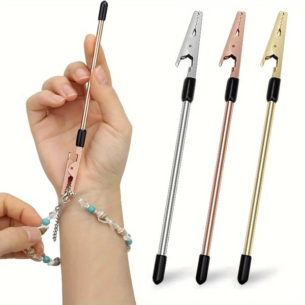 A hand holds a multi-purpose bracelet and joint repair tool with various metal tips.