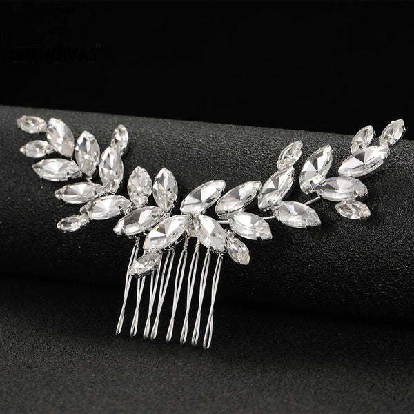 A delicate crystal fairy bridal hair comb headpiece with sparkling leaves and dangling strands.