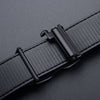 A close-up of a black men's automatic buckle belt with a crocodile pattern texture.
