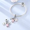 Sterling silver charm bracelet featuring a pass port and luggage tag charms