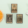 A set of three tarot card enamel pins featuring woodland animals and symbolic imagery on a light green background.